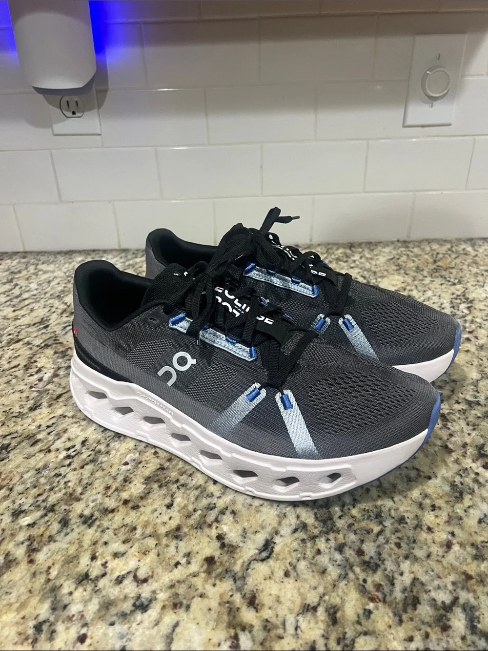 On Running Men's/Women's Trainer in Black and Gray with White Sole